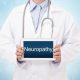Doctor holding up a sign that says "neuropathy"